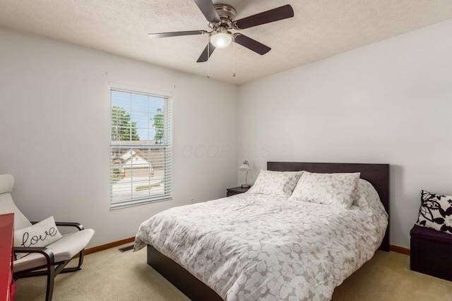 5899 Cove Point Ct, Columbus, OH 43228 - carpeted bedroom featuring a textured ceiling and ceiling fan