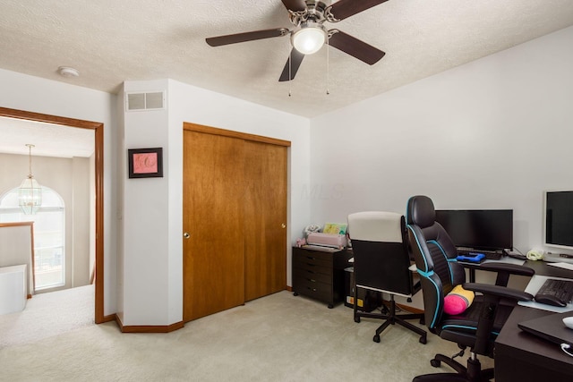 5899 Cove Point Ct, Columbus, OH 43228 - home office with carpet, a ceiling fan, and a textured ceiling