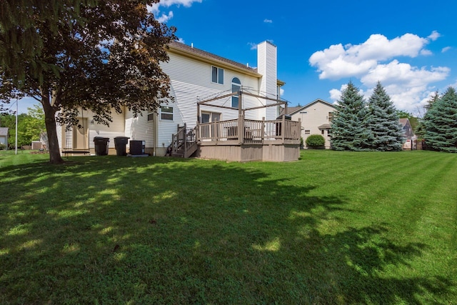 5899 Cove Point Ct, Columbus, OH 43228 - back of property featuring a deck, a yard, and a chimney