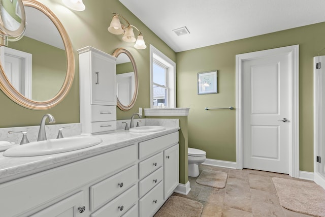 3582 Panhandle Rd, Delaware, OH 43015 - bathroom featuring double vanity and stone finish floors