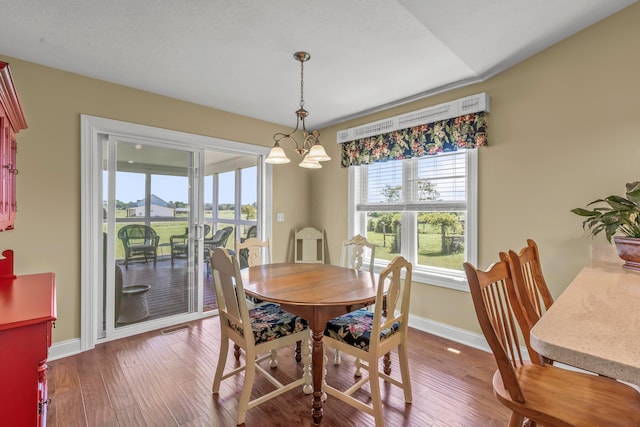 3582 Panhandle Rd, Delaware, OH 43015 - dining space featuring wood finished floors and a chandelier