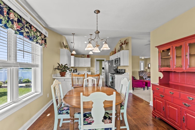 3582 Panhandle Rd, Delaware, OH 43015 - dining room with a chandelier and dark wood-style flooring