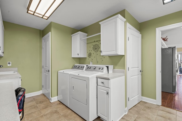 3582 Panhandle Rd, Delaware, OH 43015 - laundry area with separate washer and dryer and cabinet space