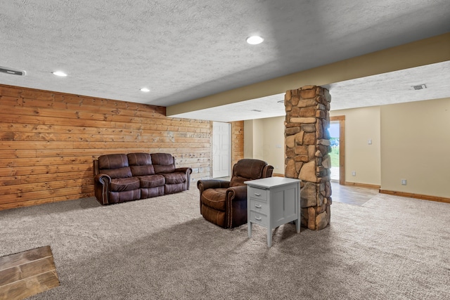 3582 Panhandle Rd, Delaware, OH 43015 - carpeted living area with a textured ceiling, recessed lighting, and wood walls