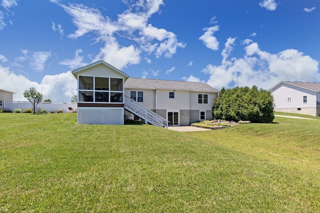 3582 Panhandle Rd, Delaware, OH 43015 - rear view of property with a sunroom, stairs, and a lawn