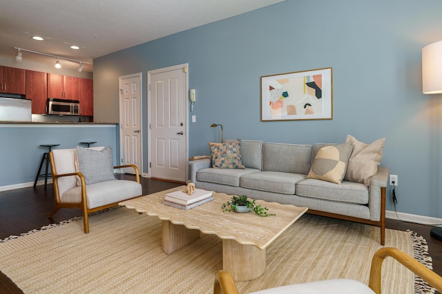 114 E Mound St Unit 1, Columbus, OH 43215 - living room with dark wood finished floors and track lighting
