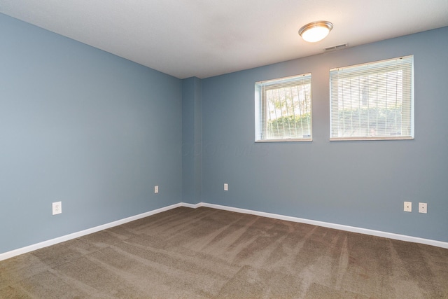 114 E Mound St Unit 1, Columbus, OH 43215 - empty room with dark carpet and baseboards