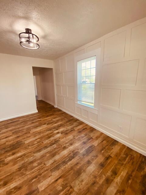 121 Maple St, London, OH 43140 - unfurnished room with a textured ceiling and wood finished floors