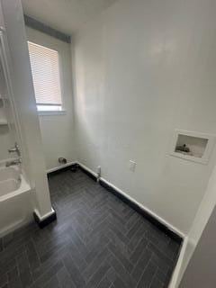 121 Maple St, London, OH 43140 - laundry room with hookup for a washing machine and brick patterned floors