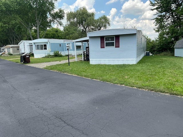 8565 Smith Calhoun Rd Unit 163, Plain City, OH 43064 - manufactured / mobile home with a front yard and a carport