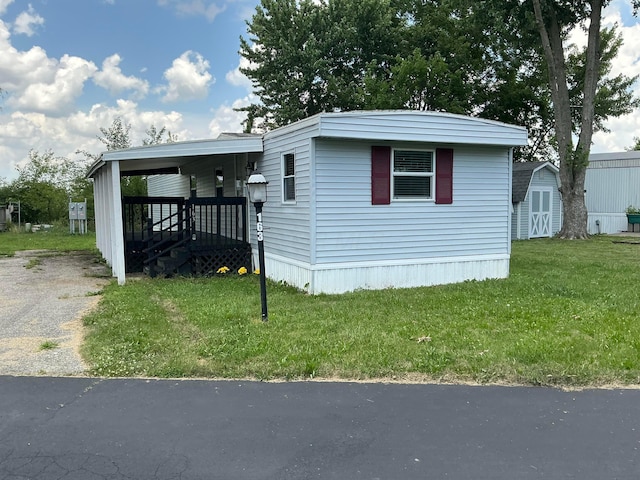 8565 Smith Calhoun Rd Unit 163, Plain City, OH 43064 - view of front of house featuring a front lawn and a storage shed