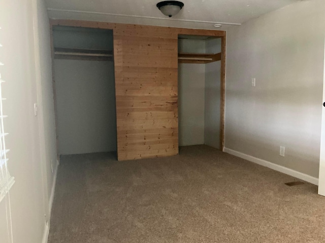 8565 Smith Calhoun Rd Unit 163, Plain City, OH 43064 - unfurnished bedroom with carpet flooring and wooden walls