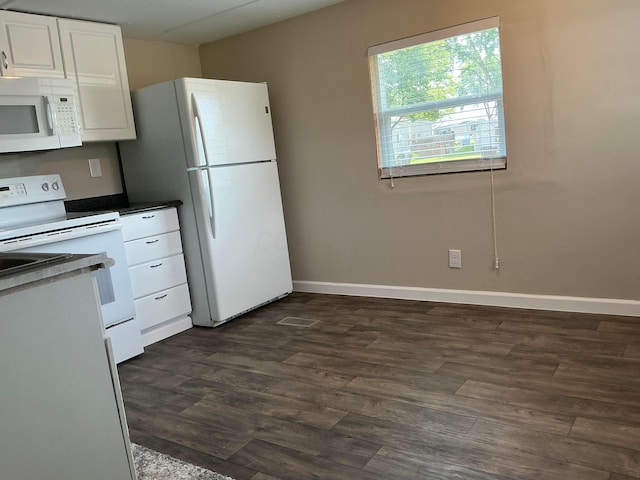 8565 Smith Calhoun Rd Unit 163, Plain City, OH 43064 - kitchen with white appliances, dark wood-style floors, white cabinets, and dark countertops
