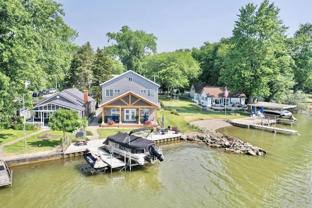 14060 Seminole Path, Lakeview, OH 43331 - dock featuring boat lift, a deck with water view, and a yard