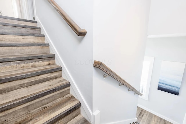 14060 Seminole Path, Lakeview, OH 43331 - stairway featuring wood finished floors and baseboards