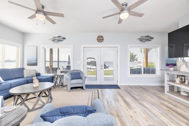 14060 Seminole Path, Lakeview, OH 43331 - living room featuring a ceiling fan, french doors, and healthy amount of natural light