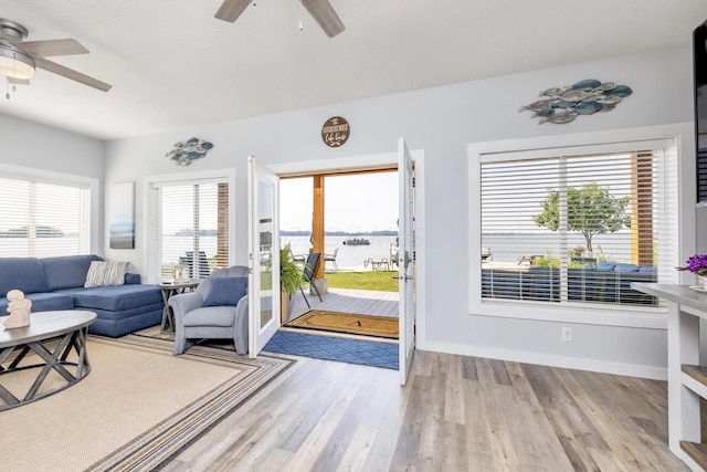 14060 Seminole Path, Lakeview, OH 43331 - living area featuring ceiling fan, light wood-type flooring, and a water view