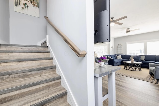 14060 Seminole Path, Lakeview, OH 43331 - stairway featuring a ceiling fan and wood finished floors