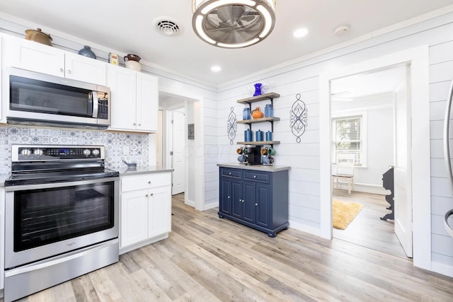 14060 Seminole Path, Lakeview, OH 43331 - kitchen with stainless steel appliances, blue cabinets, white cabinets, open shelves, and light wood finished floors