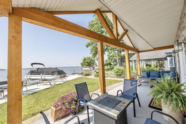 14060 Seminole Path, Lakeview, OH 43331 - view of patio / terrace with a water view and an outdoor living space with a fire pit