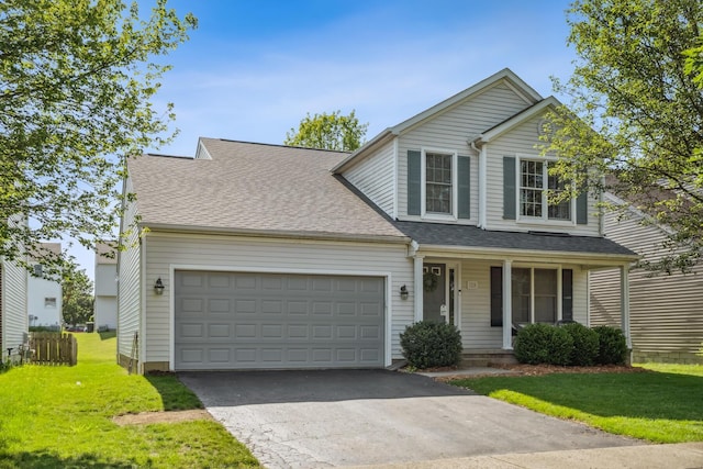 1118 Barlowe Run Dr, Blacklick, OH 43004 - traditional-style home featuring covered porch, a front lawn, a garage, asphalt driveway, and a shingled roof