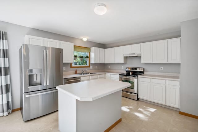 1118 Barlowe Run Dr, Blacklick, OH 43004 - kitchen featuring stainless steel appliances, under cabinet range hood, white cabinetry, light countertops, and a kitchen island