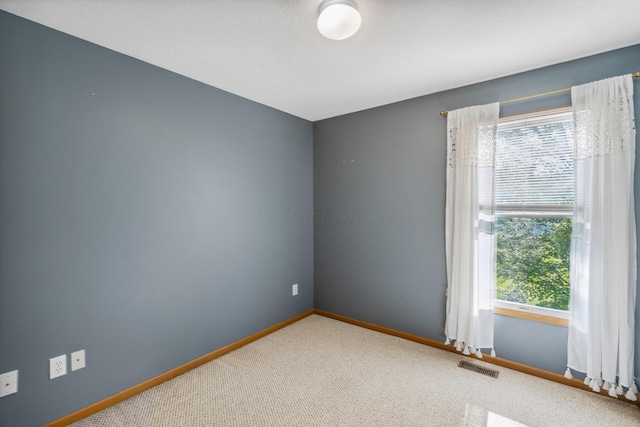 1118 Barlowe Run Dr, Blacklick, OH 43004 - empty room featuring plenty of natural light and carpet