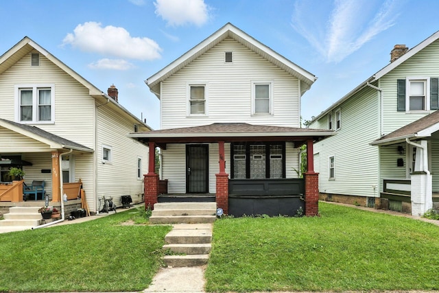 741 Heyl Ave, Columbus, OH 43206 - american foursquare style home with a porch and a front yard