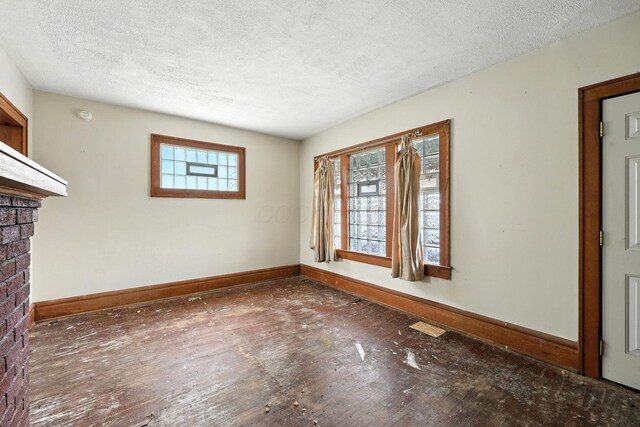 741 Heyl Ave, Columbus, OH 43206 - empty room with a textured ceiling and wood finished floors