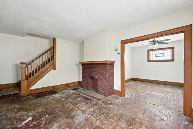 741 Heyl Ave, Columbus, OH 43206 - unfurnished living room featuring hardwood / wood-style floors, stairway, a fireplace, and a ceiling fan