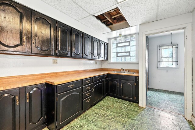 741 Heyl Ave, Columbus, OH 43206 - kitchen with butcher block counters, plenty of natural light, and dark cabinets