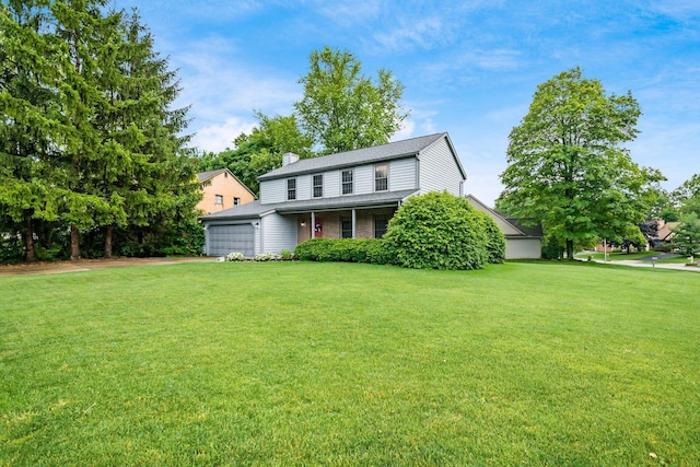 1169 Riva Ridge Blvd, Columbus, OH 43230 - traditional home with an attached garage, a front lawn, a chimney, and driveway