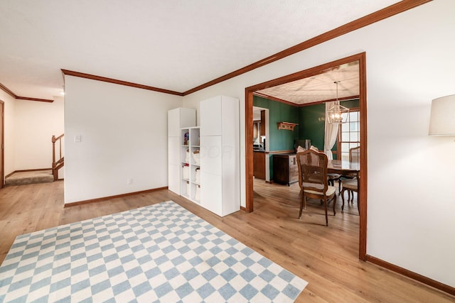 1169 Riva Ridge Blvd, Columbus, OH 43230 - entryway with light wood-style floors, a chandelier, ornamental molding, and stairs