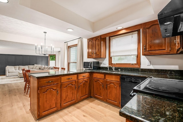 1169 Riva Ridge Blvd, Columbus, OH 43230 - kitchen with a peninsula, dishwasher, a chandelier, range hood, and stainless steel microwave