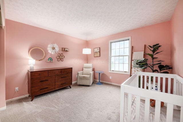 1169 Riva Ridge Blvd, Columbus, OH 43230 - bedroom with carpet, a textured ceiling, and a nursery area
