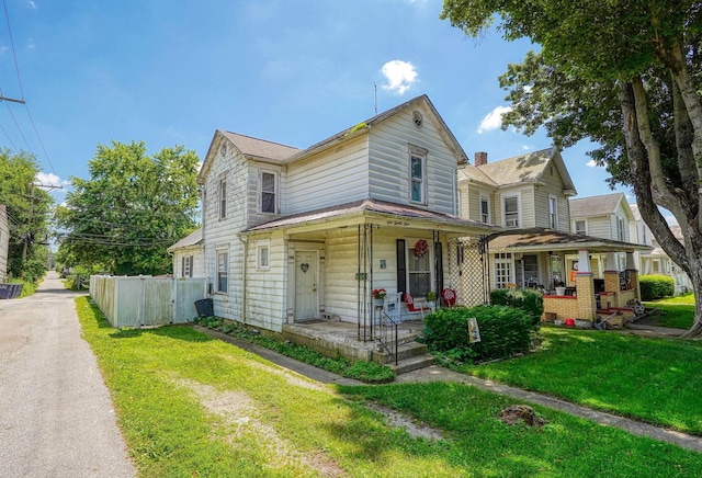 124 Wyandotte St, Lancaster, OH 43130 - view of front facade with a porch
