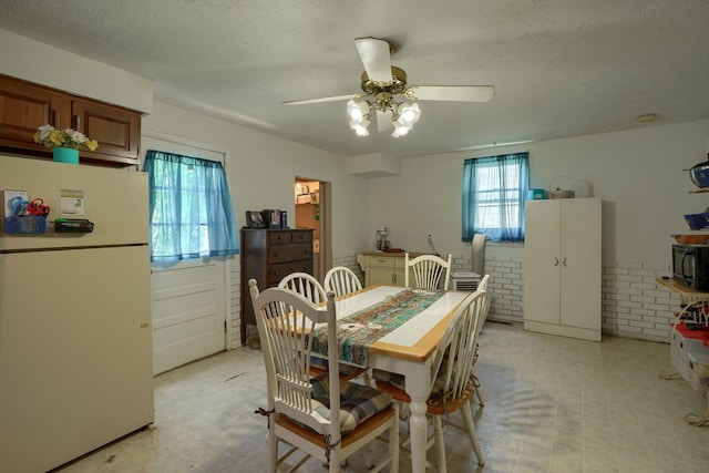 124 Wyandotte St, Lancaster, OH 43130 - dining area with light flooring, ceiling fan, and a textured ceiling