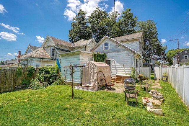 124 Wyandotte St, Lancaster, OH 43130 - back of house with a fenced backyard and a shingled roof
