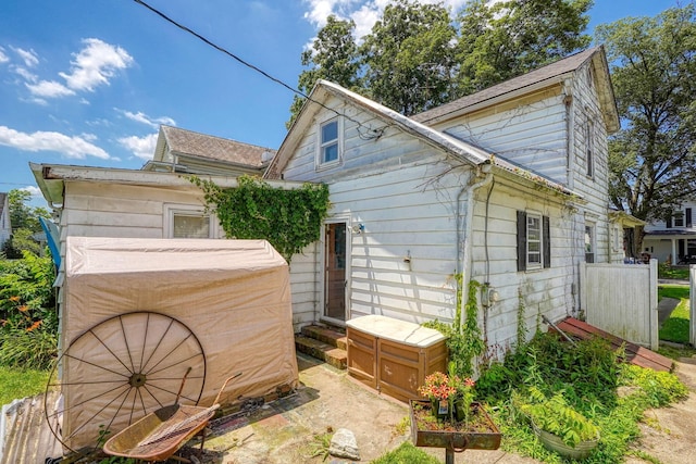 124 Wyandotte St, Lancaster, OH 43130 - rear view of house with entry steps and a shingled roof