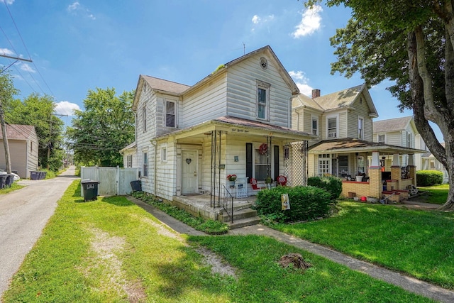 124 Wyandotte St, Lancaster, OH 43130 - view of front facade with covered porch and a front lawn