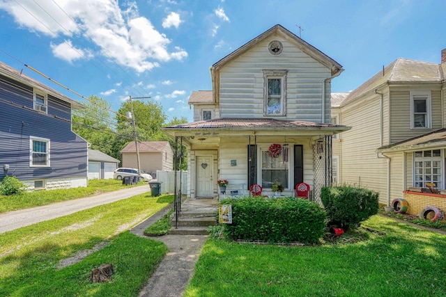 124 Wyandotte St, Lancaster, OH 43130 - view of front of house featuring a porch and a front yard