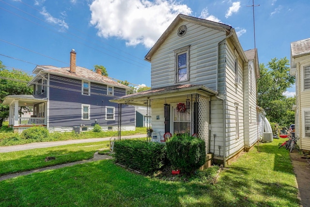 124 Wyandotte St, Lancaster, OH 43130 - view of front of house with a porch and a front yard