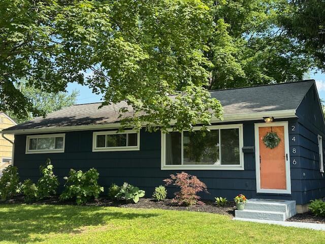 2486 Cranford Rd, Columbus, OH 43221 - view of front of property with a front yard and roof with shingles