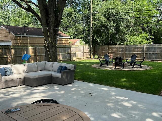 2486 Cranford Rd, Columbus, OH 43221 - fenced backyard featuring an outdoor living space with a fire pit and a patio