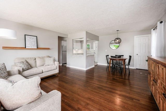 2486 Cranford Rd, Columbus, OH 43221 - living room with dark wood finished floors and a textured ceiling