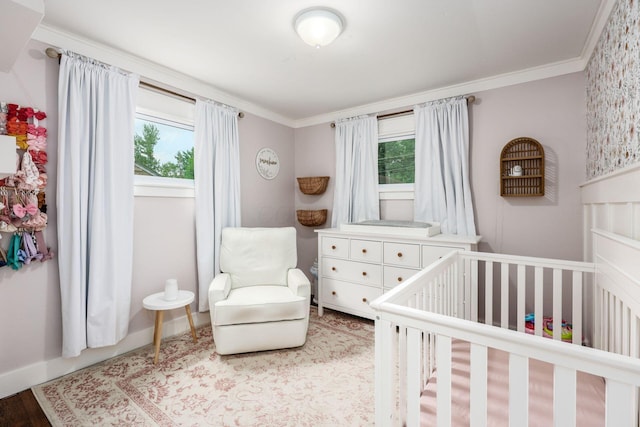 2486 Cranford Rd, Columbus, OH 43221 - bedroom with multiple windows, a nursery area, ornamental molding, and wood finished floors