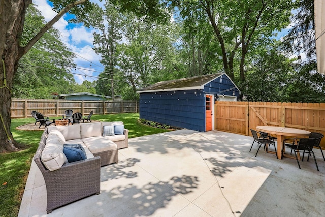 2486 Cranford Rd, Columbus, OH 43221 - fenced backyard featuring a patio, outdoor dining area, a shed, and an outdoor living space with a fire pit