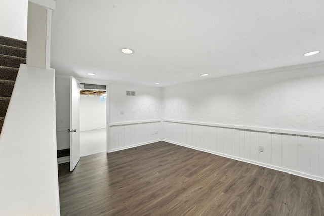 2663 Cedar Lake Dr, Dublin, OH 43016 - empty room featuring dark wood-style flooring, stairway, wainscoting, and recessed lighting