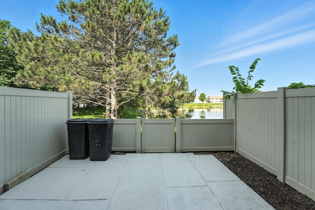 2663 Cedar Lake Dr, Dublin, OH 43016 - view of patio / terrace with a gate and a water view
