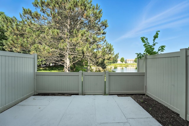 2663 Cedar Lake Dr, Dublin, OH 43016 - view of patio with a gate and a water view